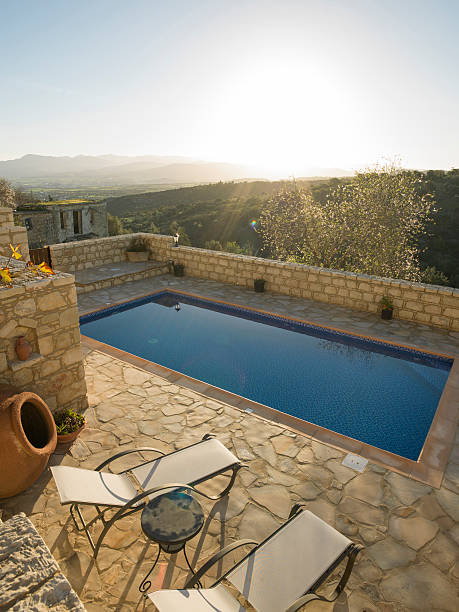 istock Sunrise over distant hills and swimming pool 471156052