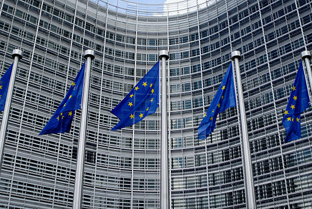 istock European Union flags outside modern office building 471157111