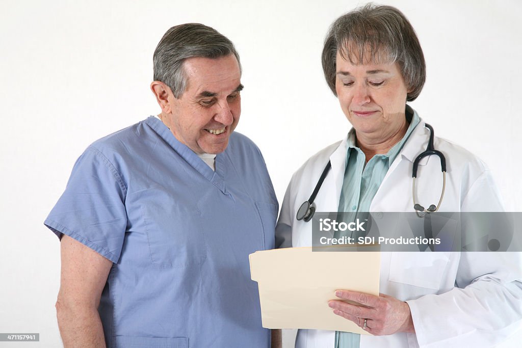 Doctor Explaining to Patient Accidents and Disasters Stock Photo