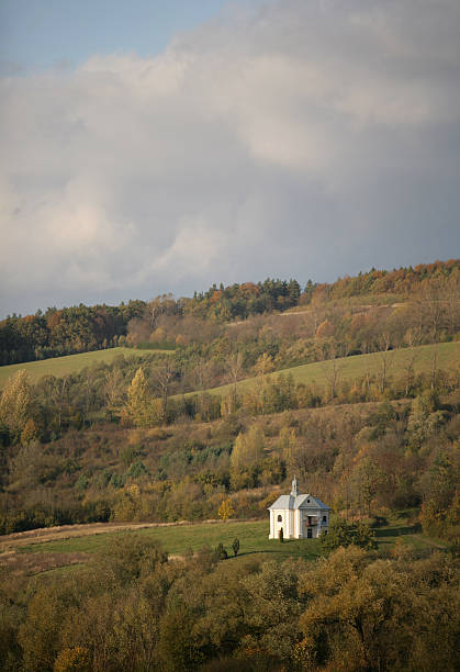 istock white chappel standing on the hill in southern Poland 471158529