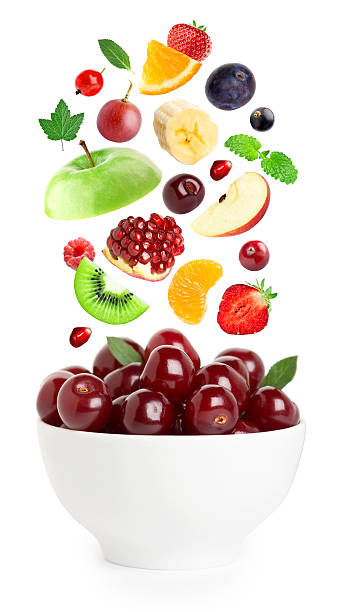 istock Falling fresh fruits and berries in bowl 471158688