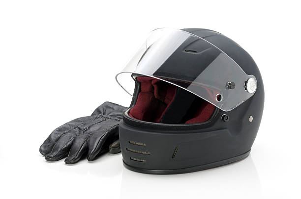 istock Black helmet w/visor and leather gloves-isolated on white 471158927