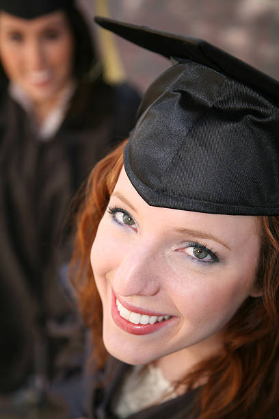 istock Happy Female Graduate and her friends 471161165
