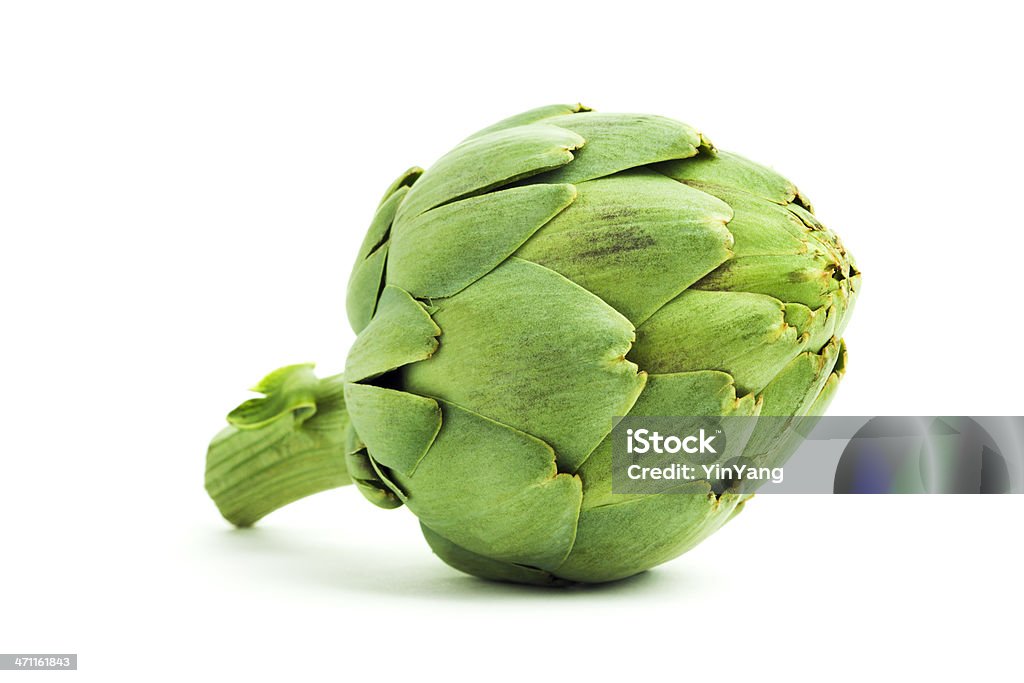 Artichoke, Fresh Green Vegetable with Edible Heart, Isolated on White An artichoke, a fresh, raw, green vegetable with an edible heart. The food may be grown organically in a garden or on a commercial farm for healthy eating. The grocery is an ingredient of gourmet or vegetarian meals. Cut out and isolated on white, with soft shadows to add dimension. Artichoke Stock Photo