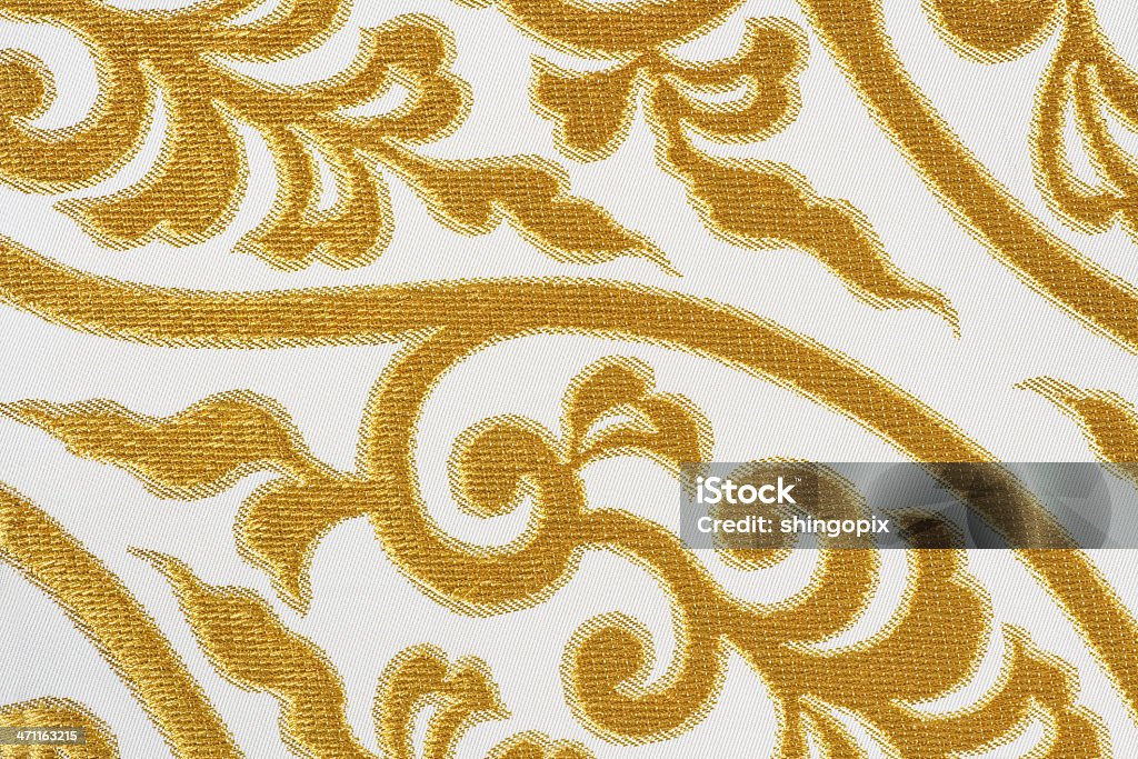 Golden silk fabric Expensive golden silk fabric for japanese kimono dress. Abstract Stock Photo