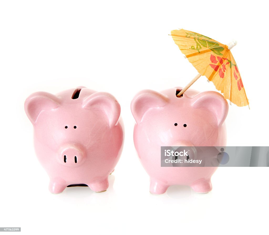 Cocktail Piggybank Piggybank with cocktail umbrella on white Banking Stock Photo