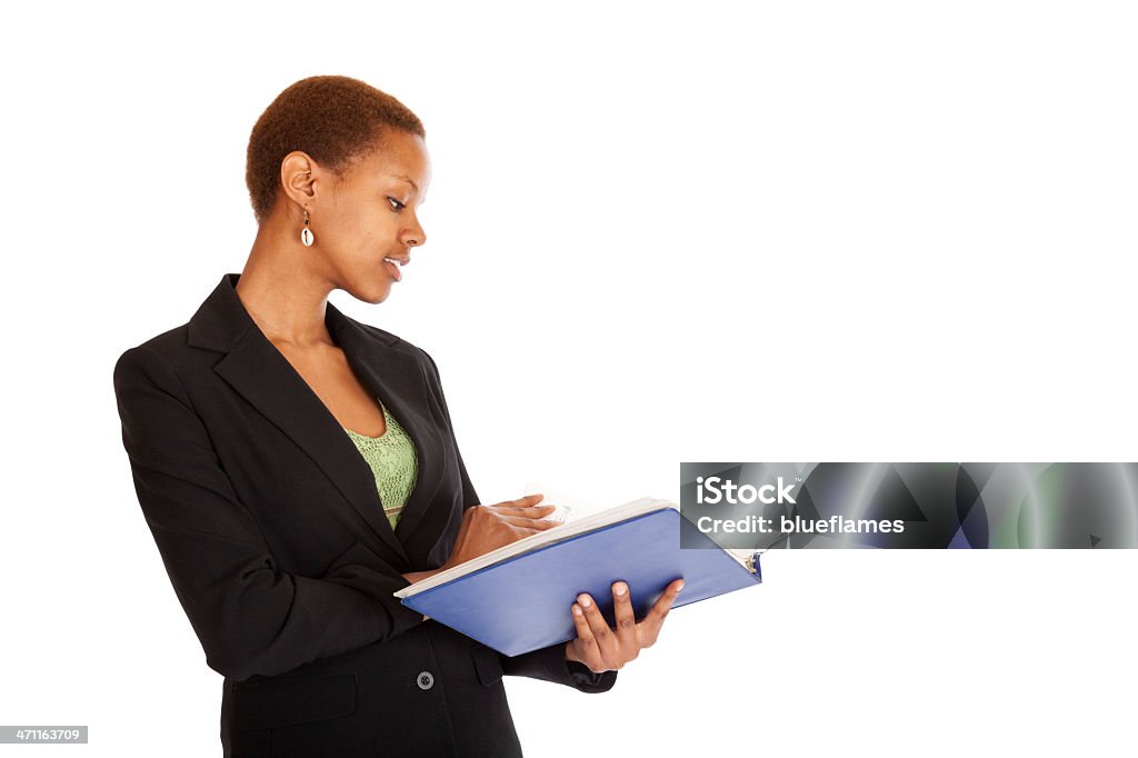 working professional a young professional reviews a folder  25-29 Years Stock Photo