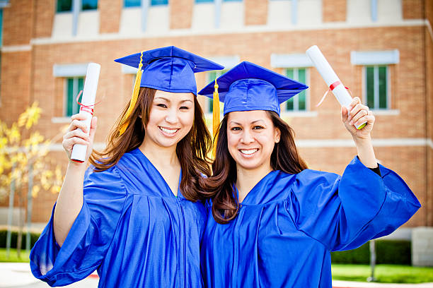istock two beautiful female graduates 471164633