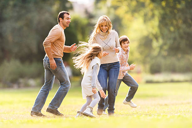 istock Playful family having fun in the park. 471164848