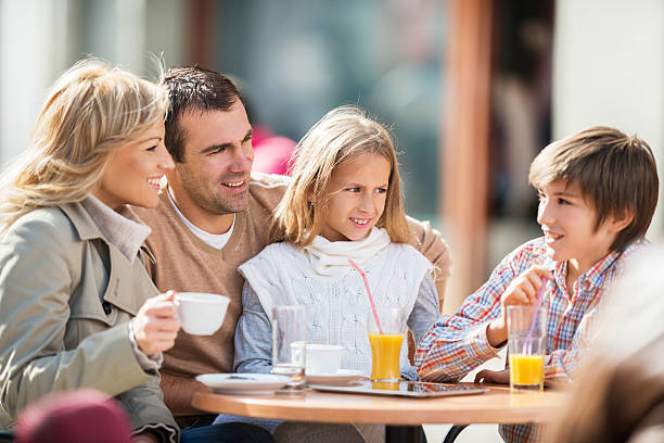 istock Family sitting in a cafe and communicating. 471164864