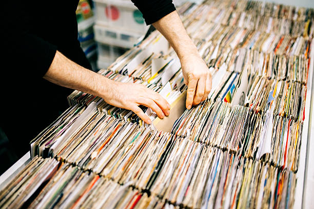 istock Searching through second hand vinyl records in a record store 471164872