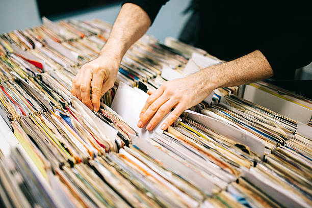 istock Searching through second hand vinyl records in a record store 471164874