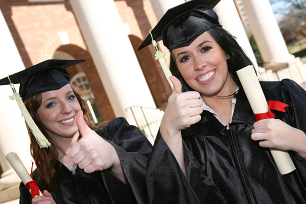 istock Female graduates giving the thumbs up! 471165083