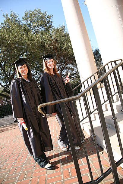 istock Two Happy Graduates Walking up to Graduation Ceremony 471165137