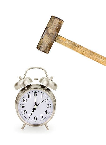 Alarm Clock and Hammer Traditional alarm clock and hammer isolated on white. I don't want to get up! smash alarm clock stock pictures, royalty-free photos & images