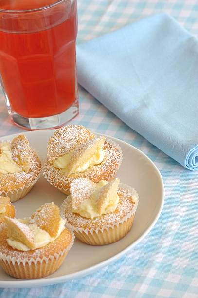 istock Plate of fairy cakes with fruit juice 471167393