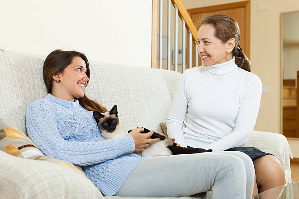 istock Mother and  daughter on sofa 471168216