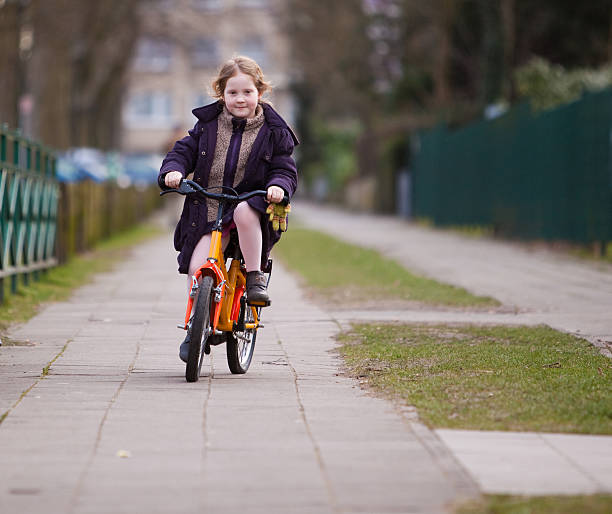 istock Little girl on bike 471168337