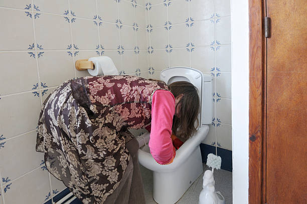 istock woman deep cleaning toilet 471169005