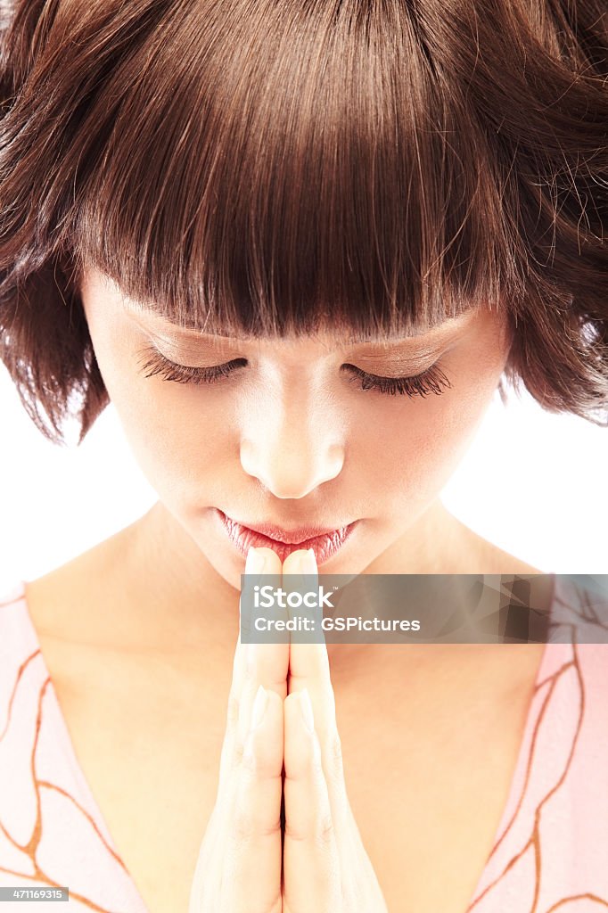 Prayer Close-up of a beautiful relaxed young female praying, meditating 20-24 Years Stock Photo