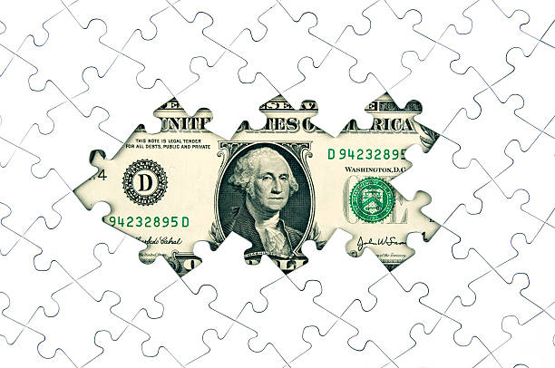 istock Dollar bill and puzzle pieces 471169481