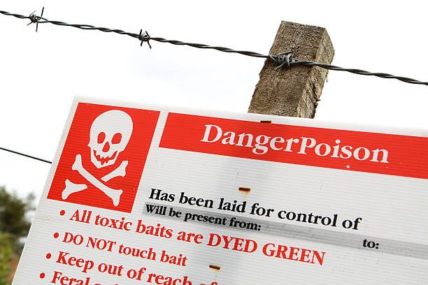 istock Poison warning sign and barbed wire 471170907