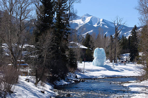 Frozen Ice Formation Along Crystal River Redstone Colorado.  View with Chair Mountain. ELk Range in background.  Flowing Crystal River.  ProPhoto RGB.