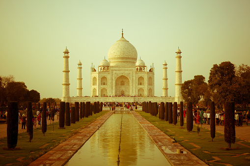 Taj Mahal at sunset, mausoleum in Agra, India - one of the most recognizable structures in the world.