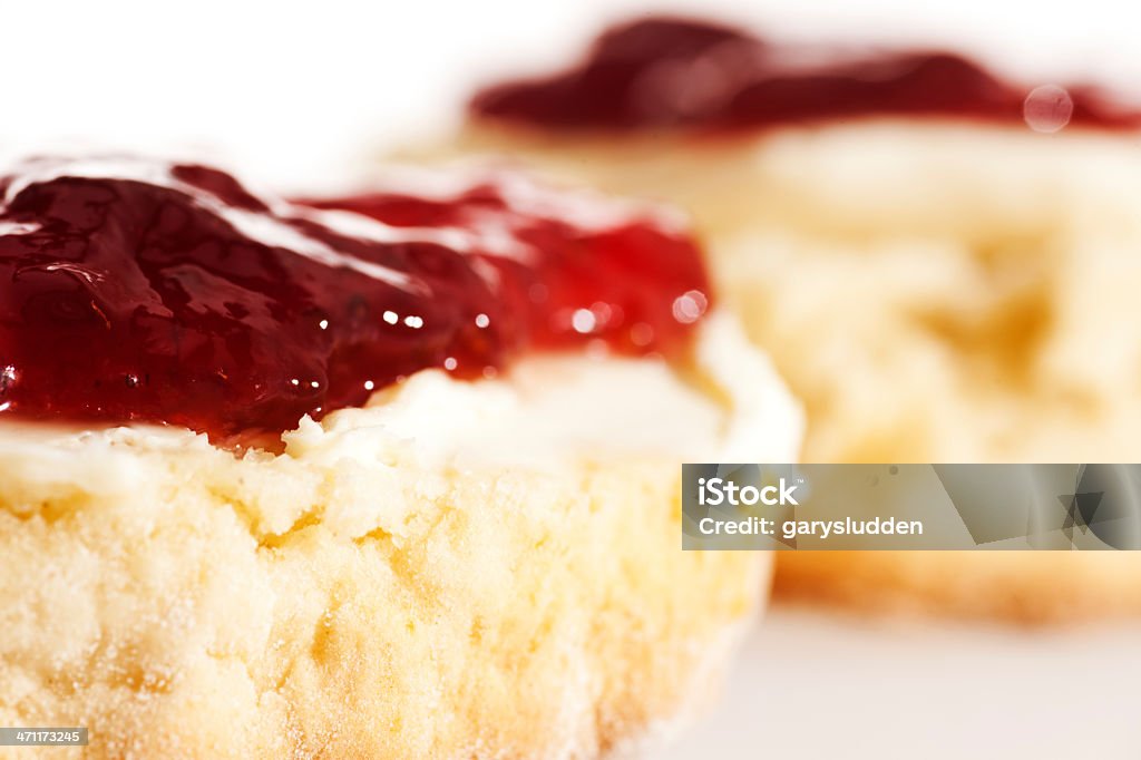 devon cream tea scones with jam and cream against a white background Beige Stock Photo