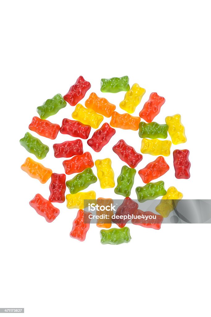 Gummy tiene lugar en un círculo en blanco - Foto de stock de Gominola en forma de oso libre de derechos