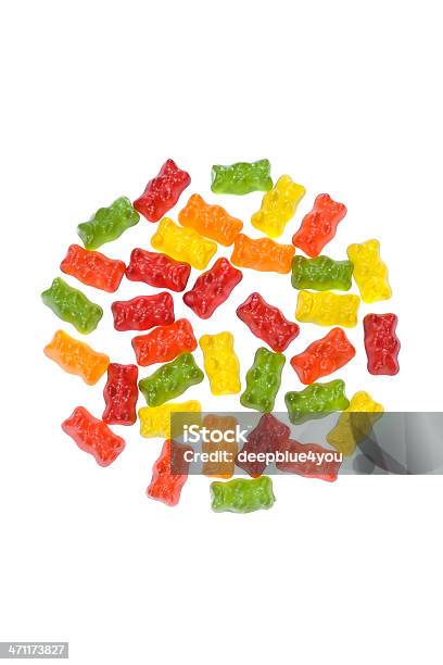 Gummy Tiene Lugar En Un Círculo En Blanco Foto de stock y más banco de imágenes de Gominola en forma de oso - Gominola en forma de oso, Pastilla de goma, Amarillo - Color