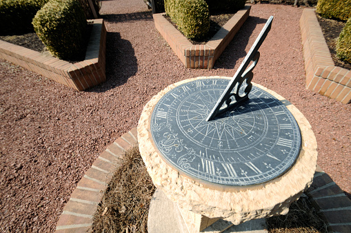 This is an beautiful old sun dial, the time keeping device of the ancients. It is a wonderful symbol for anything related to time. This is also in a nicely landscaped garden and may be useful in that regard too. 
