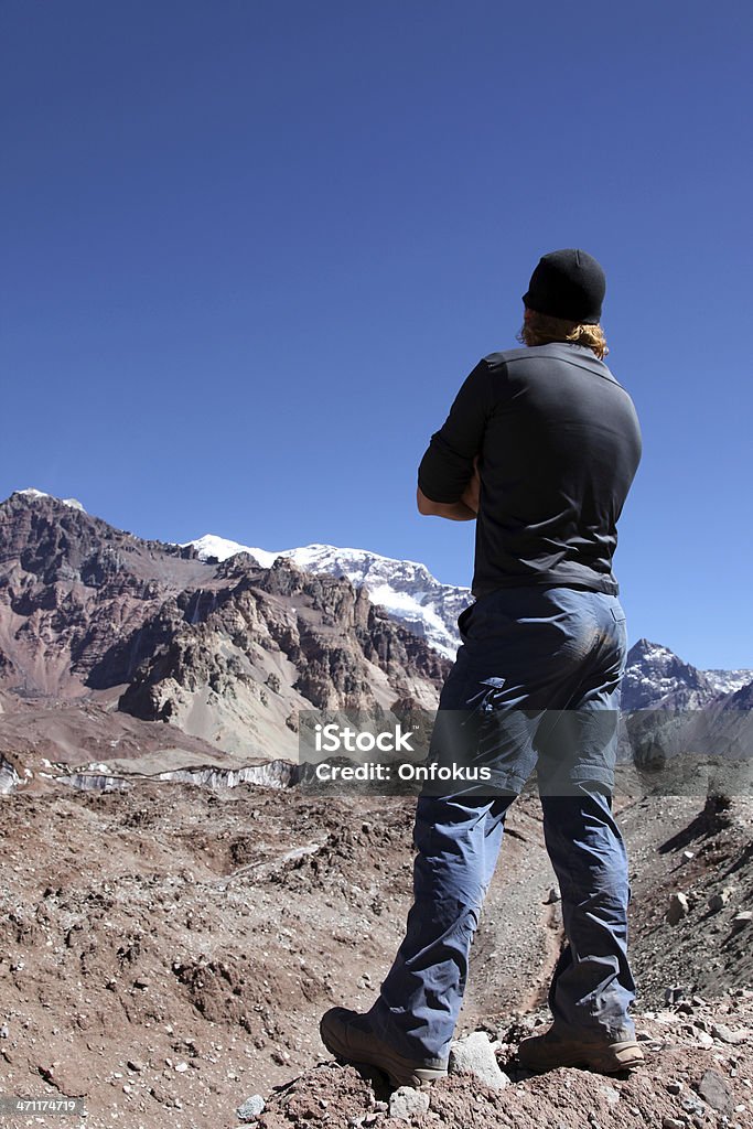 Man Hiker Looking at the Mount Aconcagua Summit, Argentina Man looking at  the Aconcagua summit, Highest peak of all Americas Aconcagua Provincial Park Stock Photo