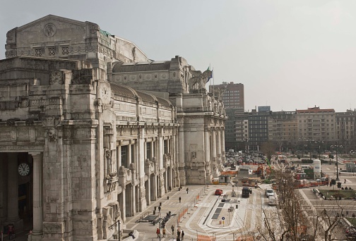 Milan, Italy - March 19, 2015: Milano Central Station building, with Piazza Duca d'Aosta below, in a sunny day