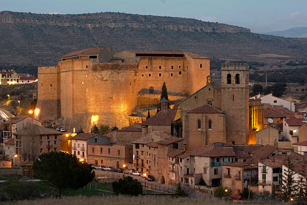 Medieval castle and church of Mora de Rubielos (Teruel, Spain) View of the spanish medieval castle and church of Mora de Rubielos (Teruel, Aragon, Spain) at sunset. tungsten image stock pictures, royalty-free photos & images