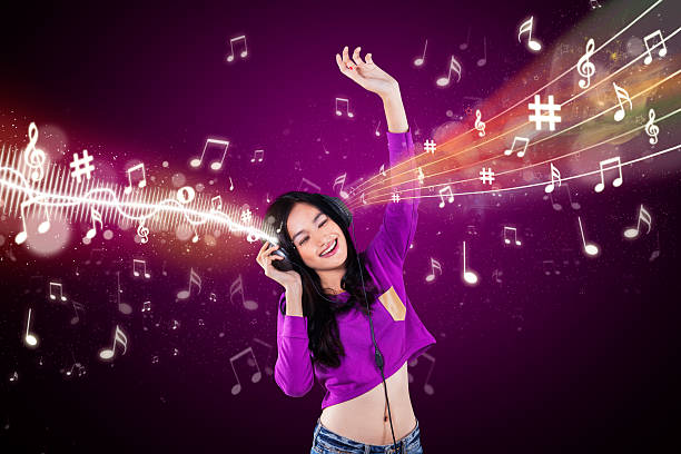 istock Modern girl listening music 471175004