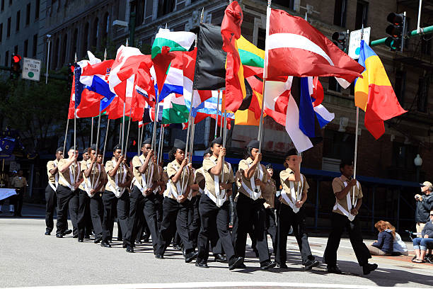 Nato Parade of Flags Norfolk, Va. USA - April 26, 2014: At the annual Nato Parade of Nations in Norfolk, Virginia a military group carries the flag of all nations during the parade route. nato stock pictures, royalty-free photos & images