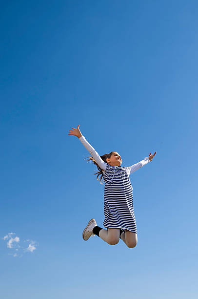istock Young girl jumping 471175087