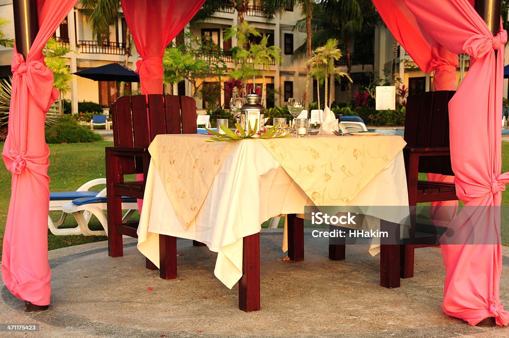 Special Occasion Meal A romantic meal set-up for a special occasion at a beach resort.   Beach Stock Photo