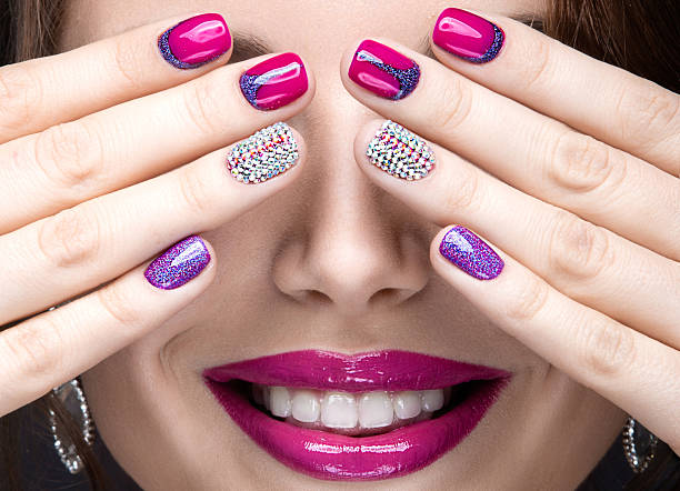 istock girl with a bright evening make-up and pink manicure 471175862