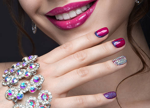istock girl with a bright evening make-up and pink manicure 471176942