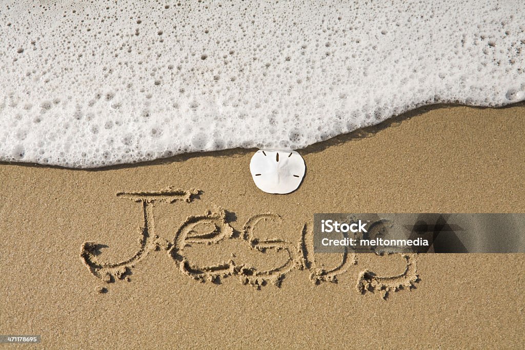 Jesus Written in the Sand  Beach Stock Photo