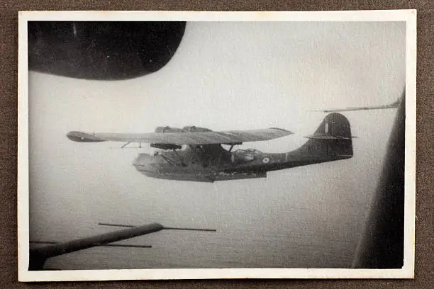 Rare wartime aerial photograph of RAF Catalina flying boats above the Mediterranean on reconnaissance while enroute to East Africa via Egypt in 1943. Some dust and scratches reflect age and condition of original image.