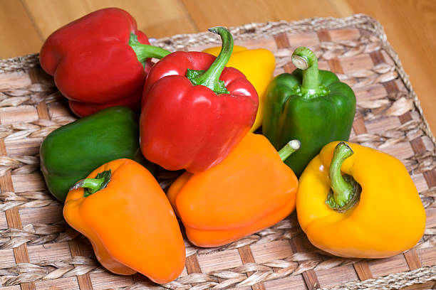 istock Red, green, orange and yellow peppers on the table. 471182961