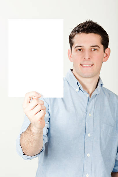 istock young beautiful happy man holds document isolated on white 471184379