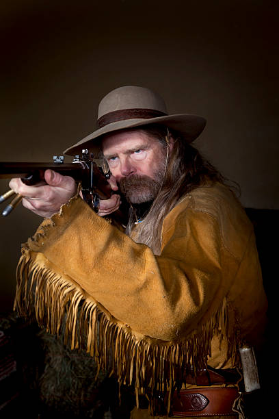 istock Mountain Man and His 45-70 Sharps Rifle. 471185013