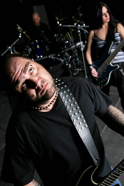 istock Rock Band with Guitarist looking up 471185509