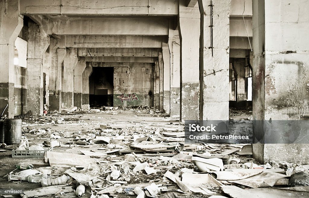 Destroyed interior of an industrial building Destroyed interior of an industrial building.Desaturated and toned image. Abandoned Stock Photo