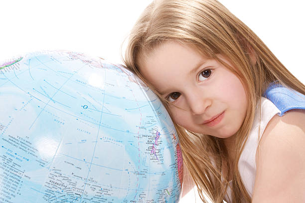 istock girl and a globe 471185699