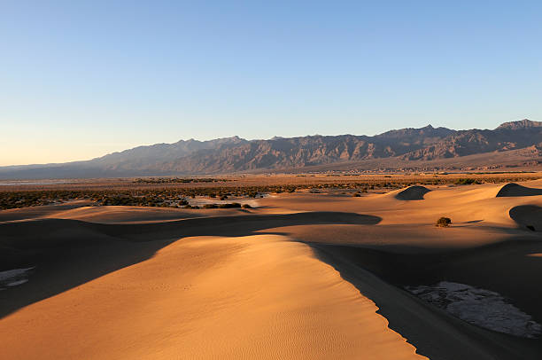istock Death Valley at sunset with dunes and desert mountains. 471185813